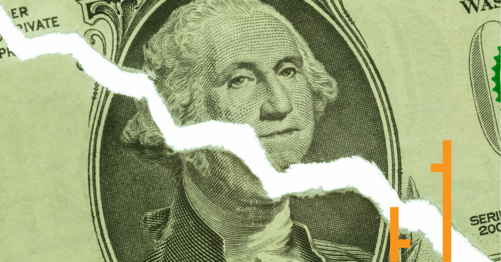 Close-up of a torn U.S. dollar bill featuring George Washington's portrait, with The Chartist's orange logo overlay, symbolizing US currency decline.